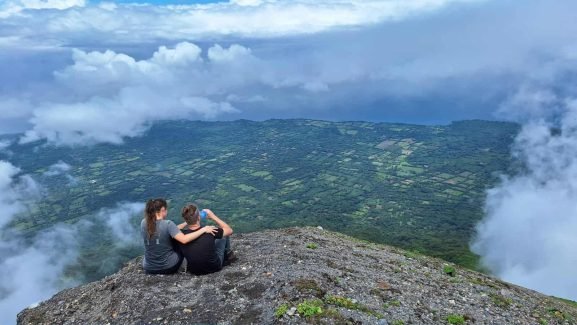 Couple overlooking rainy season Ometepe